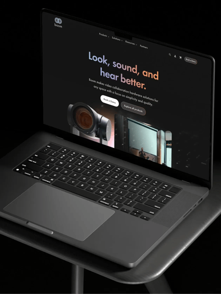Boom Collaboration's website homepage displayed on a laptop