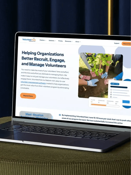 VolunteerHub's website homepage shown on a laptop